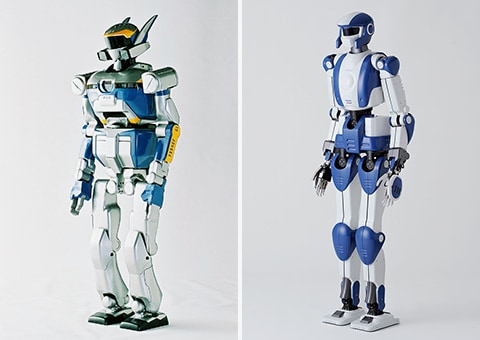 川田工業が産総研と共同で開発したヒューマノイドロボット「HRP-2」（左）、「HRP-4」（右）の写真