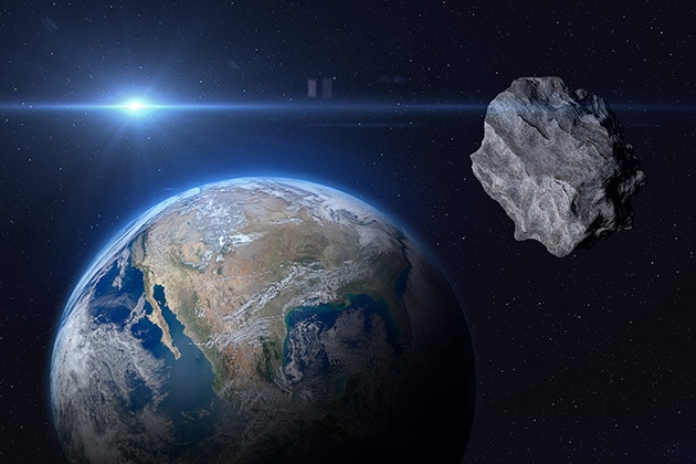 地球に接近する小惑星のイメージ